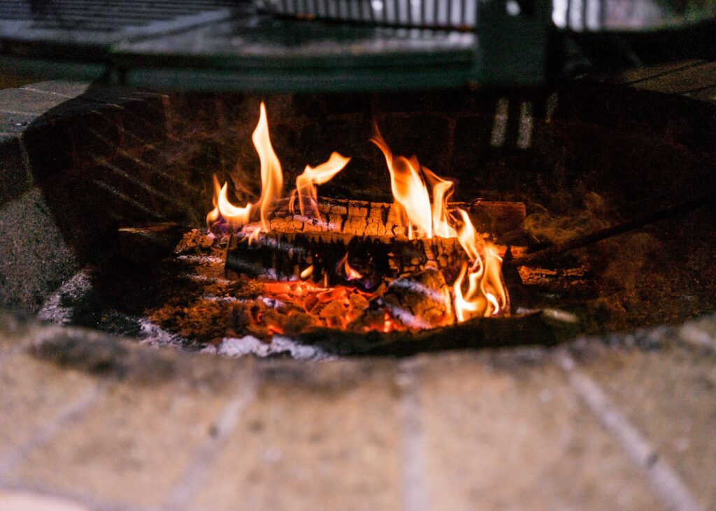 Close up shot of a fire in a brick fire pit