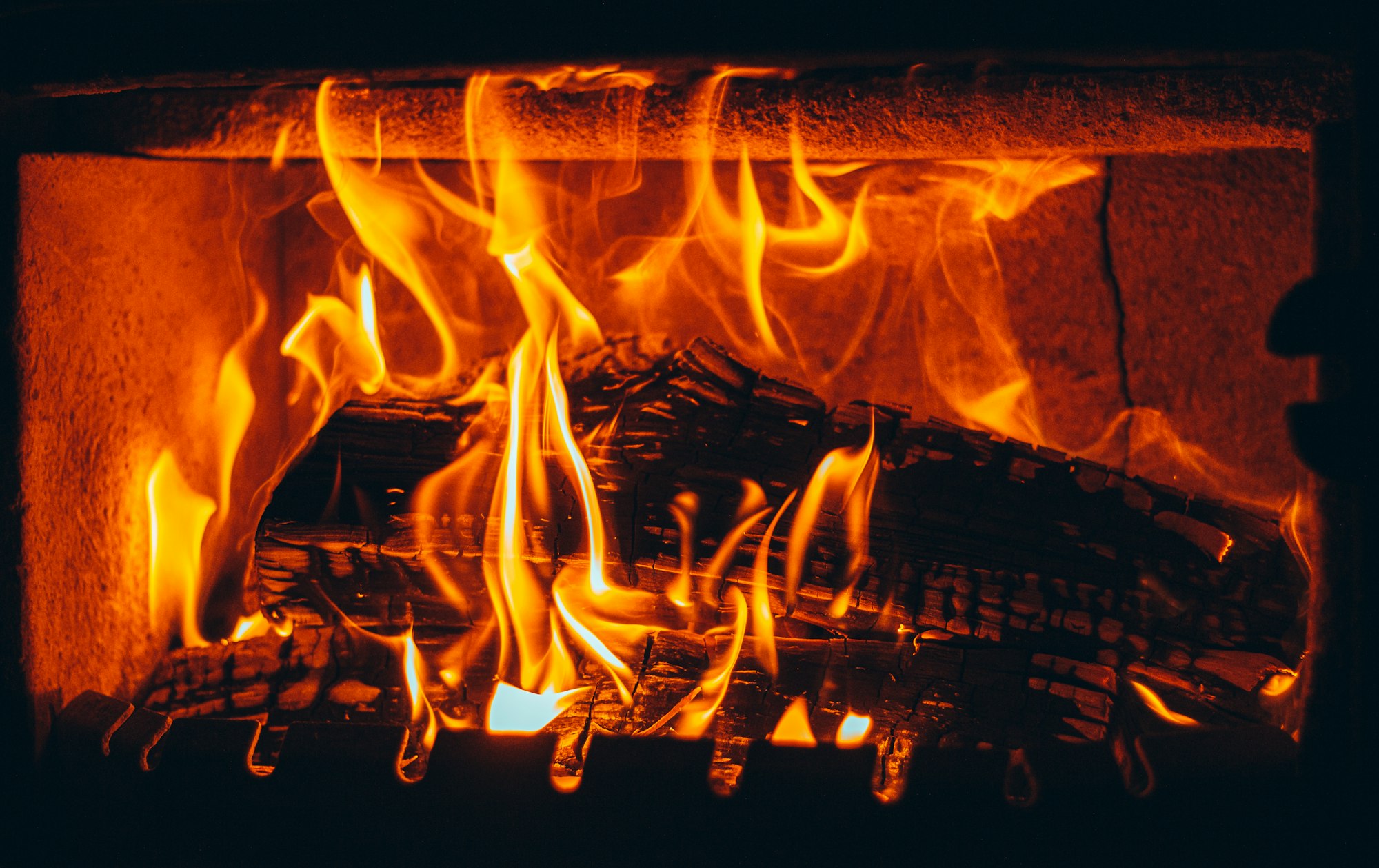 Beautiful closeup of wood planks being burnt in the fireplace